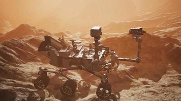 Curiosity Mars Rover exploring the surface of red planet. Elements of this image furnished by NASA photo