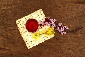 Pesach Still-life with wine and matzoh jewish passover bread photo