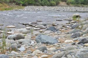 A river with rocks, focus in water photo