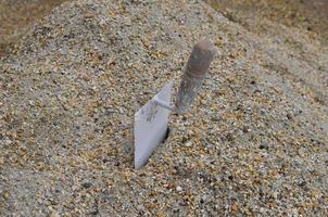 Trowel in sand photo