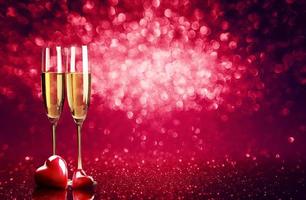 Romantic celebration of Valentine's day, with champagne and festive background. photo
