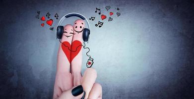 feliz pareja de dedos enamorada de los auriculares. ilustración 3d foto