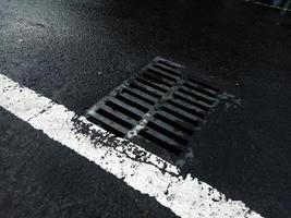 Metal Drain Cover on Street. Water Drainage photo