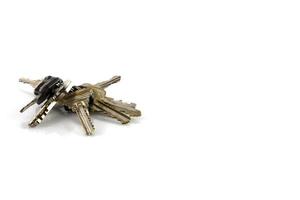 Large bunch of keys isolate on white background photo