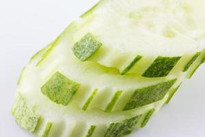 cucumber slice texture isolate on white background photo