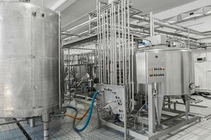 electronic control panel and tank at a milk factory. equipment at the dairy plant photo