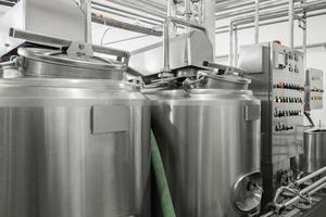 storage and pasteurization tank at the milk factory. equipment at the dairy plant photo