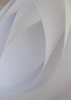 abstract background of a twisted sheet of white paper photo