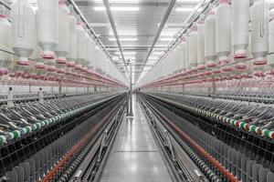 Machinery and equipment in the workshop for the production of thread. Industrial textile factory photo