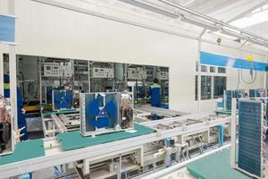 factory floor for production and assembly of household air conditioners on the conveyor belt photo