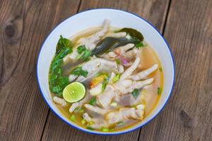 sour and spicy chicken feet soup, chicken feet soup bowl photo