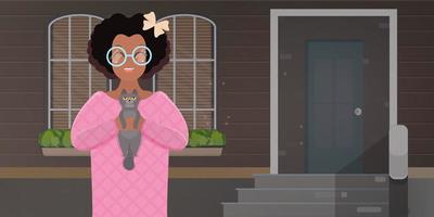 African American girl playing with a cat. A dark-skinned girl with curly hair is holding a gray cat. Vector. vector