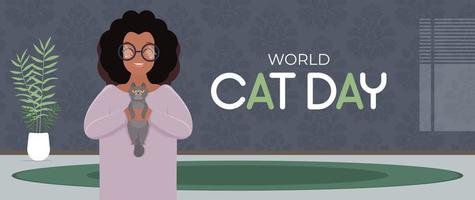 World cat day banner. A dark-skinned girl with curly hair is holding a gray cat. African American girl playing with a cat. Flat style. Vector illustration.