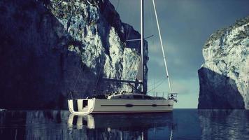yacht in the sea with greeny rocky island video