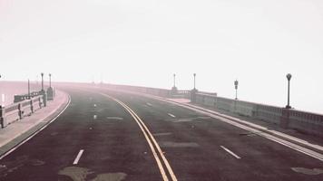 View of the bridge over the river in fog video