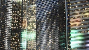 Night architecture of skyscrapers with glass facade video