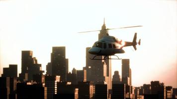 Silhouette helicopter at city scape background video