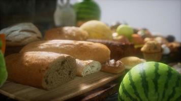 food table with wine barrels and some fruits, vegetables and bread video