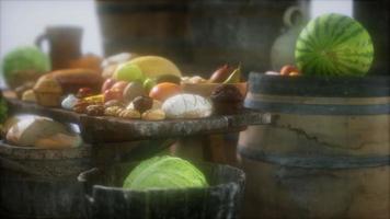 food table with wine barrels and some fruits, vegetables and bread video