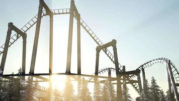 old roller coaster at sunset in forest video