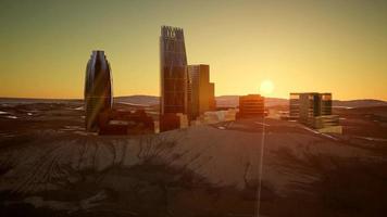 city skyscrapes in desert at sunset video