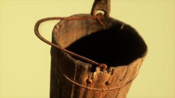 Old used rusted wooden bucket