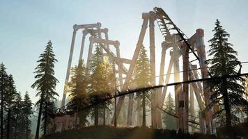 old roller coaster at sunset in forest video