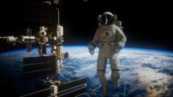 International Space Station and astronaut in outer space over the planet Earth video