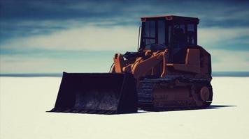 road grading machine on the salt desert road video