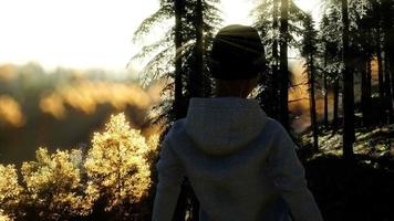 Young Woman standing alone outdoor with wild forest mountains video