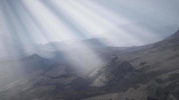 Sun Rays against the Backdrop of the Mountains video