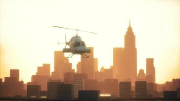 Silhouette helicopter at city scape background video