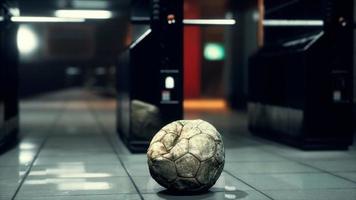 old soccer ball in empty subway video