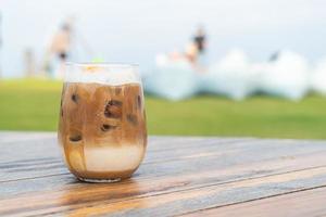 iced latte coffee glass on table photo