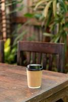 hot coffee cup on wood table photo