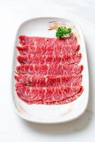 fresh beef raw sliced with marbled texture photo