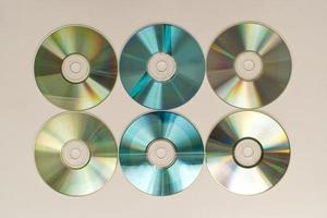 CD and DVD disk on white background. Technology from the 90s photo