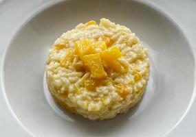 Italian Pumpkin Risotto in a white dish photo