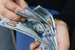 Close-up female Hands counting money American dollars photo