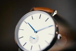 Close up of watch with brown strap photo