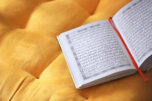 Top view The holy Quran on yellow background photo