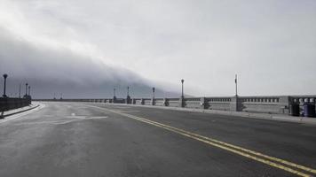 Asphalt highway and mountain in deep fog video