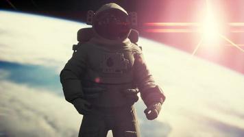 Space man astronaut in space on a background of the blue planet Earth video