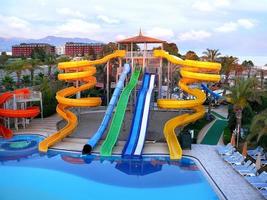 10.06.2012 Turkey. Water park water slides in the evening rays of the setting sun.10.06.2012 Turkey. photo