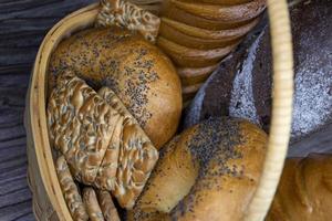 Bakery products. Bread in a basket. Christmas fir tree with lights. photo