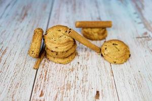 Stack of cookies with cinnamon sticks photo