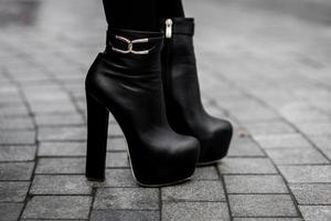 black leather boots with high heel photo