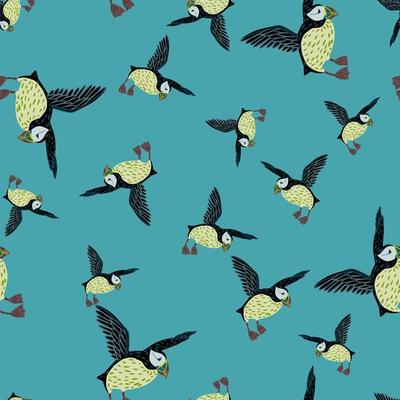 Seamless random pattern with cartoon kids style puffin bird shapes. Blue background. Arctic animal print.