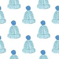 Isolated seamless pattern with blue doodle cozy hat ornament. White background. vector