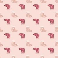 Decorative seamless pattern with christmas gift socks elements in pale pink tones. Winter backdrop. vector